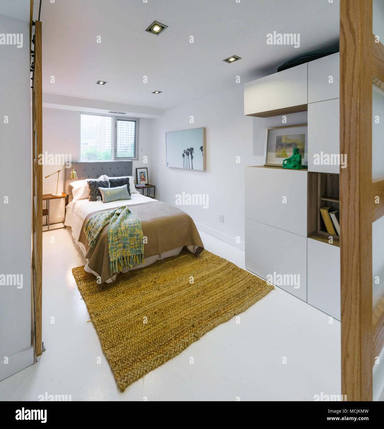 Interior of cozy bedroom in modern design Stock Photo - Alamy