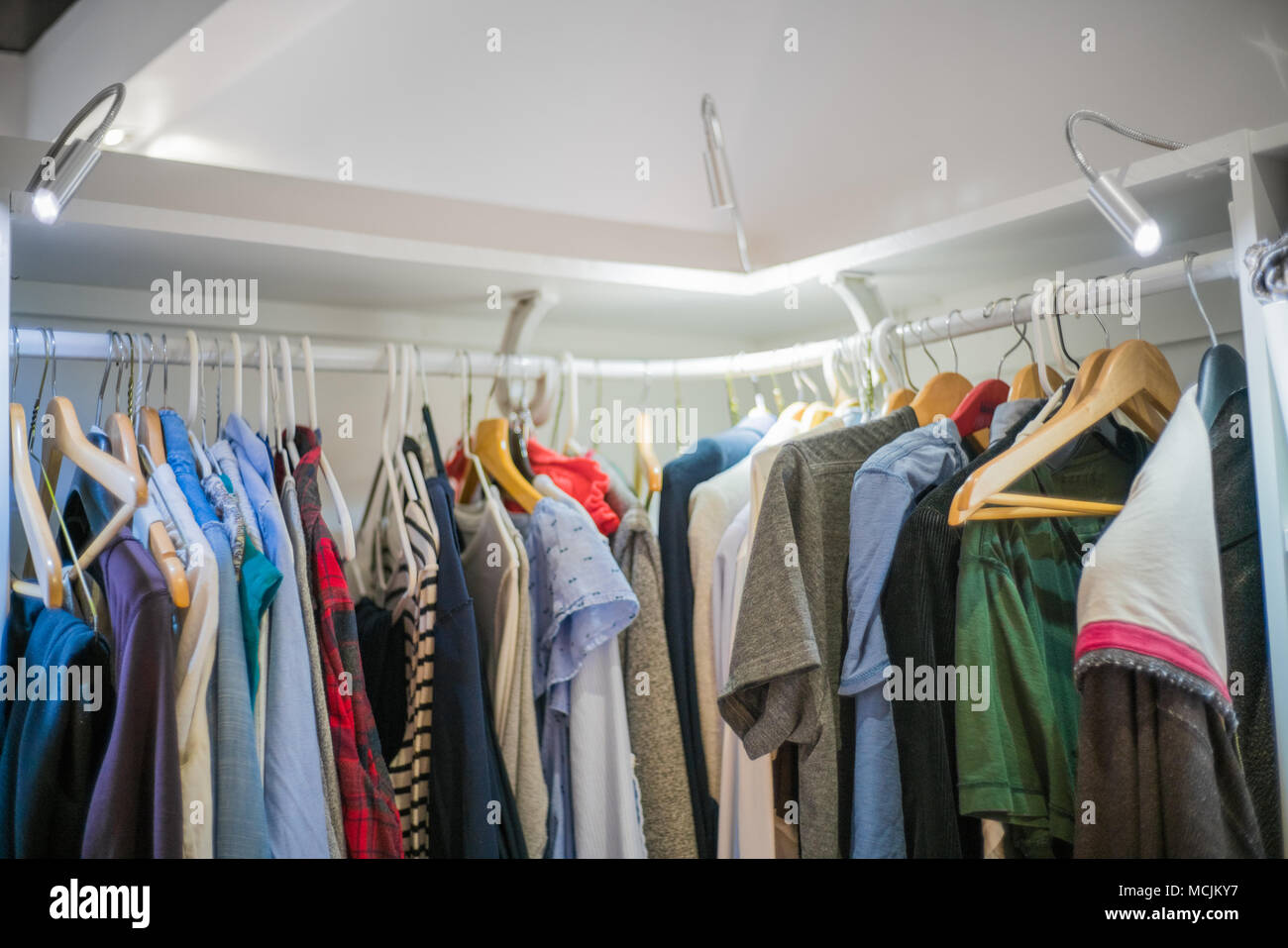 Clothes on hanger in closet Stock Photo Alamy