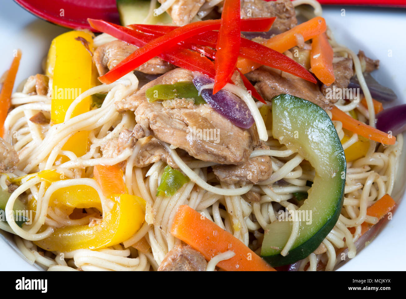 Chinese style Spicy Chicken and egg noodle stir fry Stock Photo Alamy