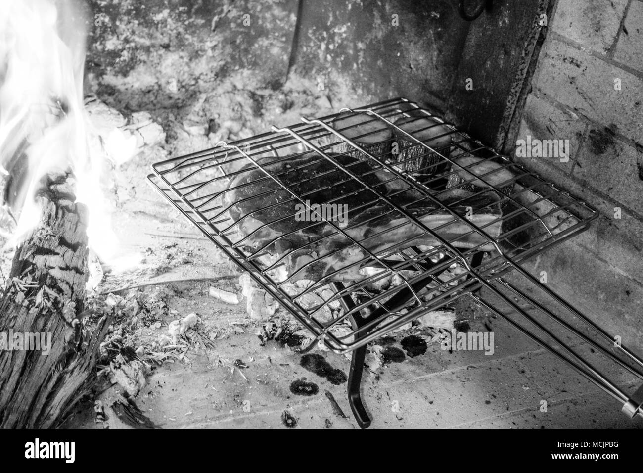 View of metal grate inside of the fireplace, Greece Stock Photo