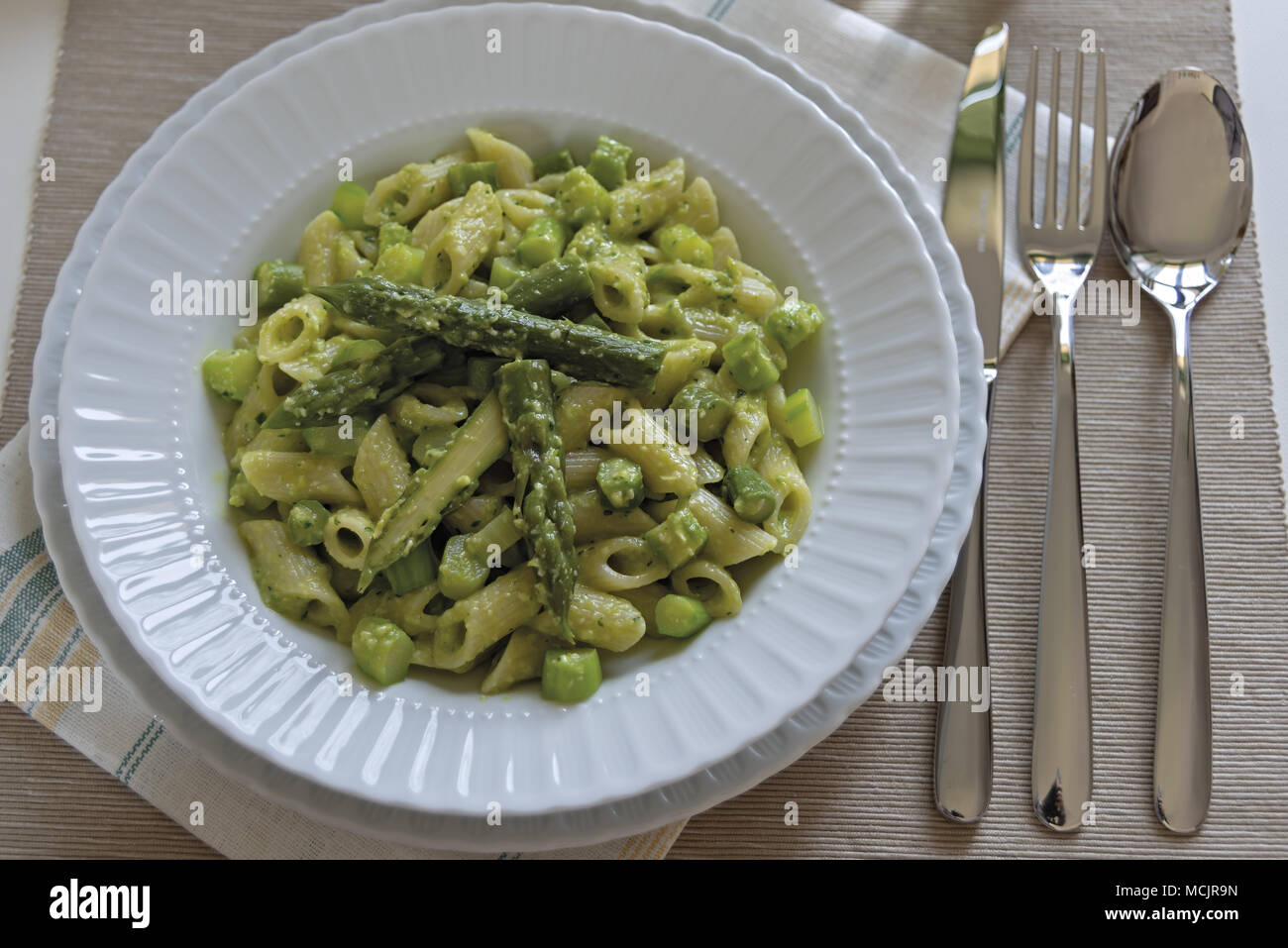 short pasta dish with asparagus and asparagus cream 4 Stock Photo