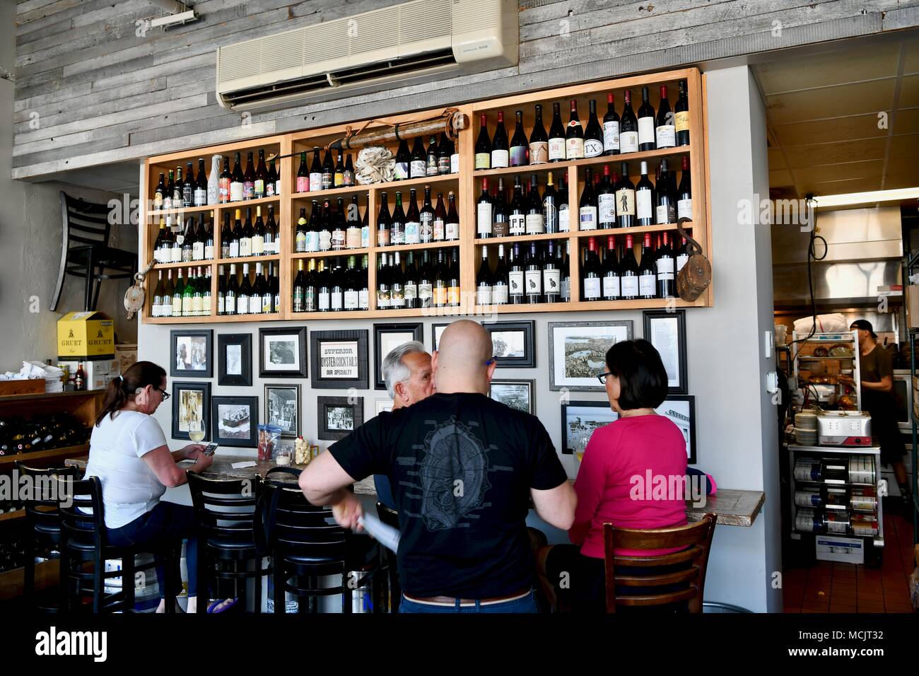 People Sitting At The Restaurant Bar Of Henlopen City Oyster House In Rehoboth Beach