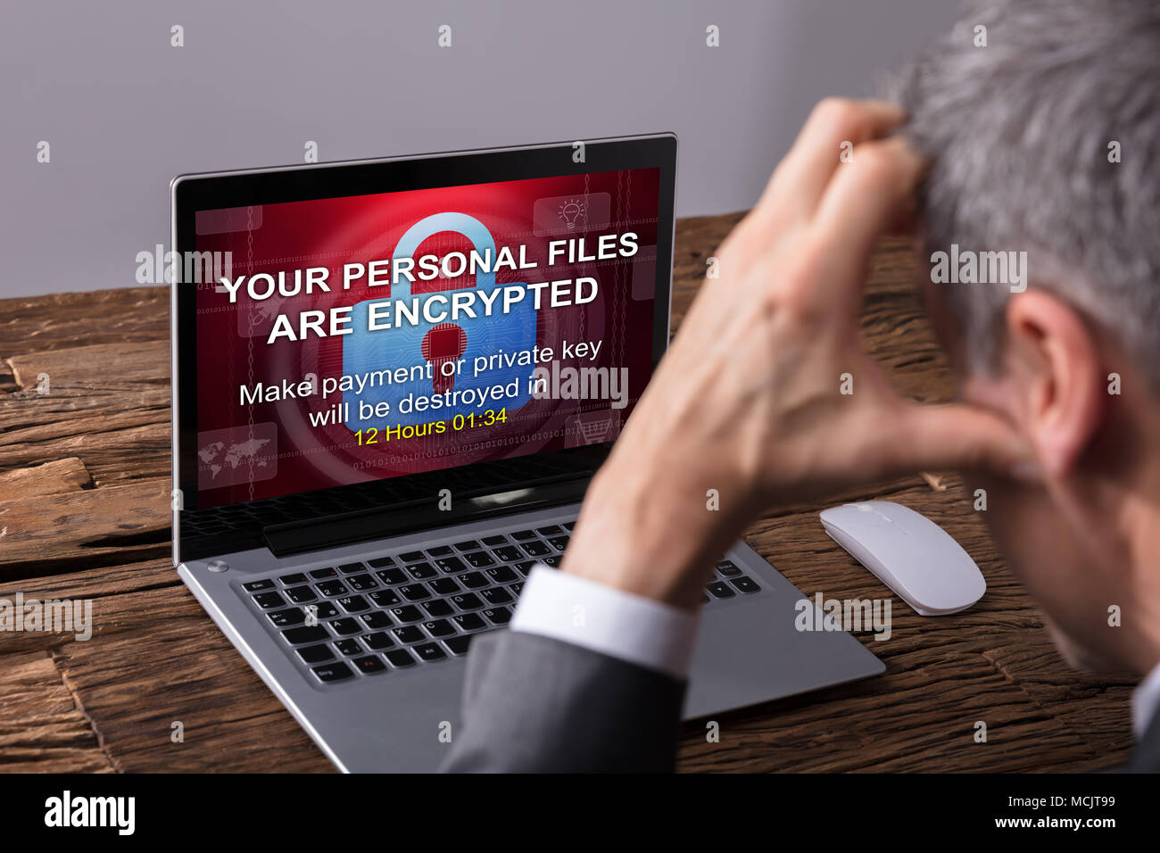 Close-up Of A Businessperson Looking At Laptop Screen Showing Personal Files Encrypted Text Stock Photo