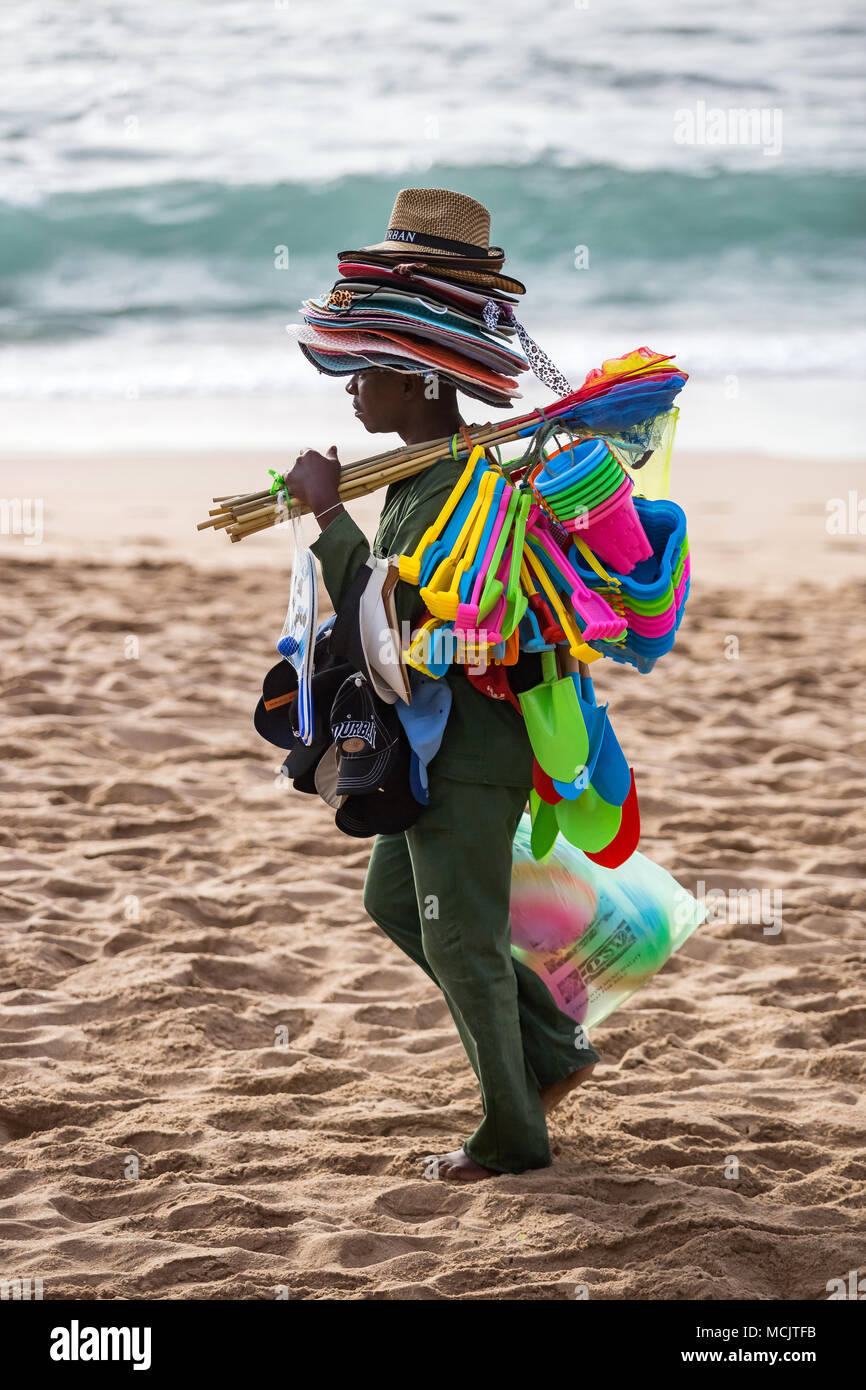 Durban, South Africa, April 9 2018 Man riding bicycle along the