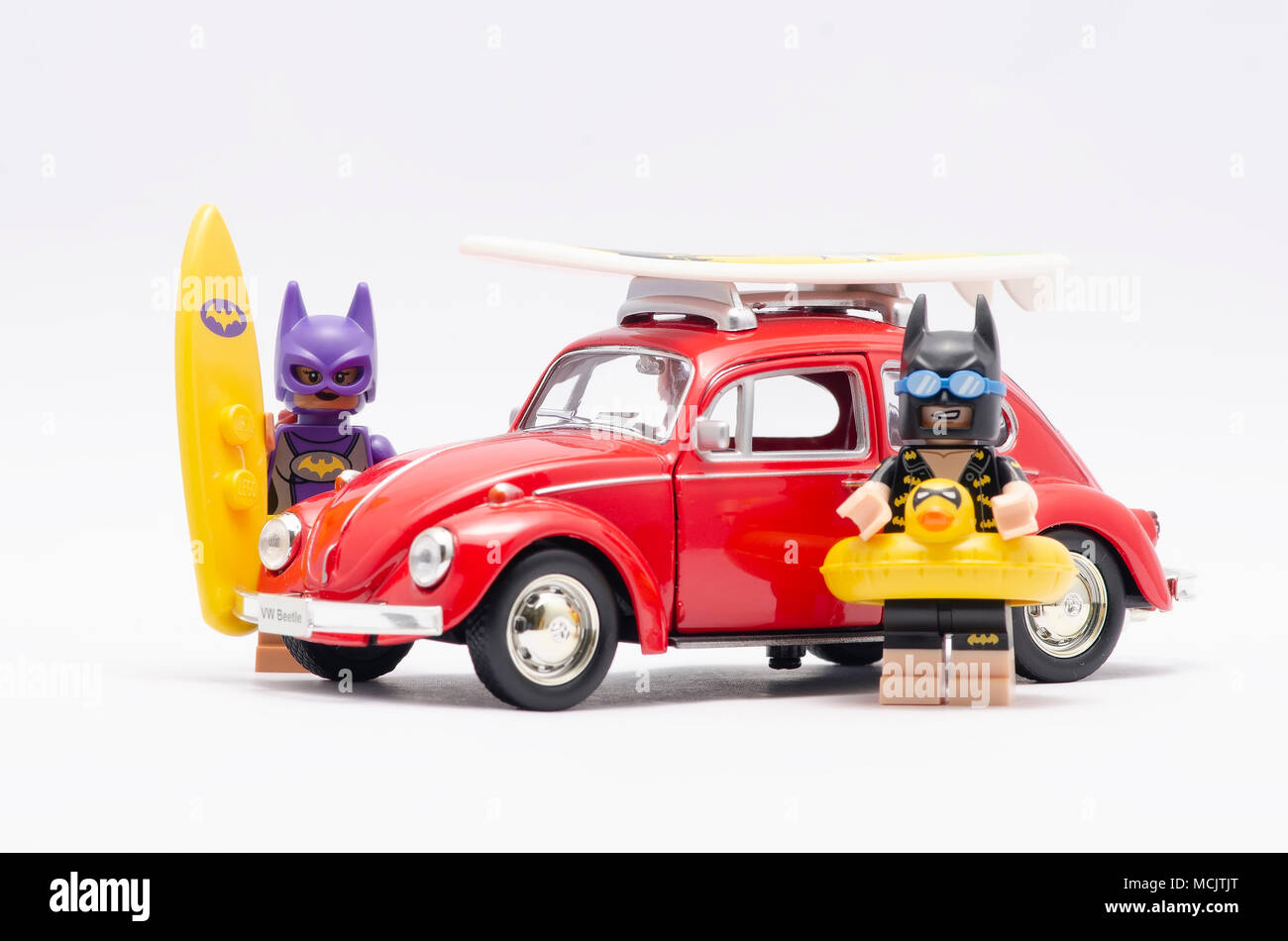 mini figure of bat girl and batman on holiday with volkswagen beetle. Lego  minifigures are manufactured by The Lego Group Stock Photo - Alamy