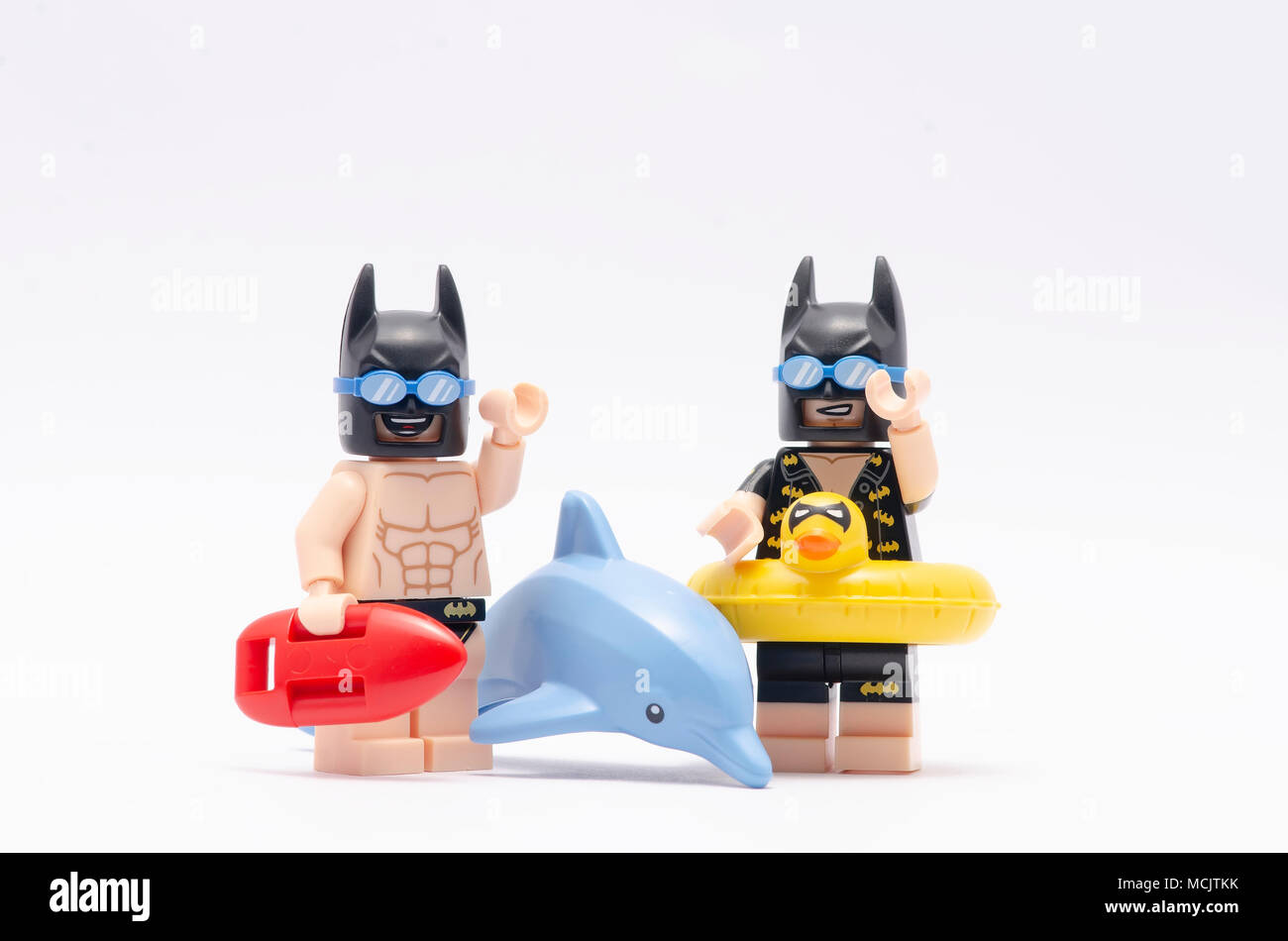 mini figure of vacation batman and beach batman and a dolphin. Lego  minifigures are manufactured by The Lego Group Stock Photo - Alamy