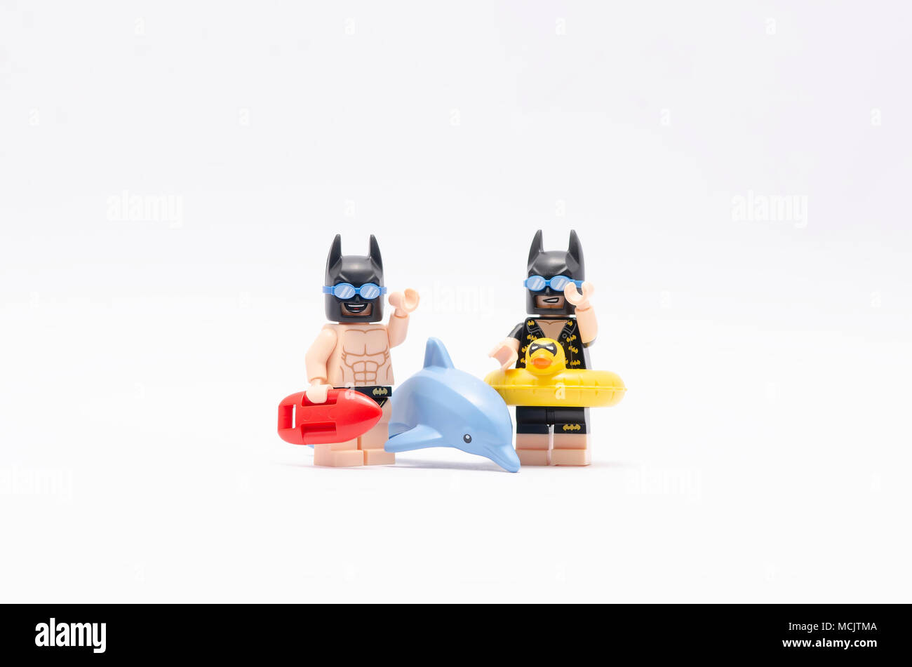 mini figure of vacation batman and beach batman and a dolphin. Lego  minifigures are manufactured by The Lego Group Stock Photo - Alamy