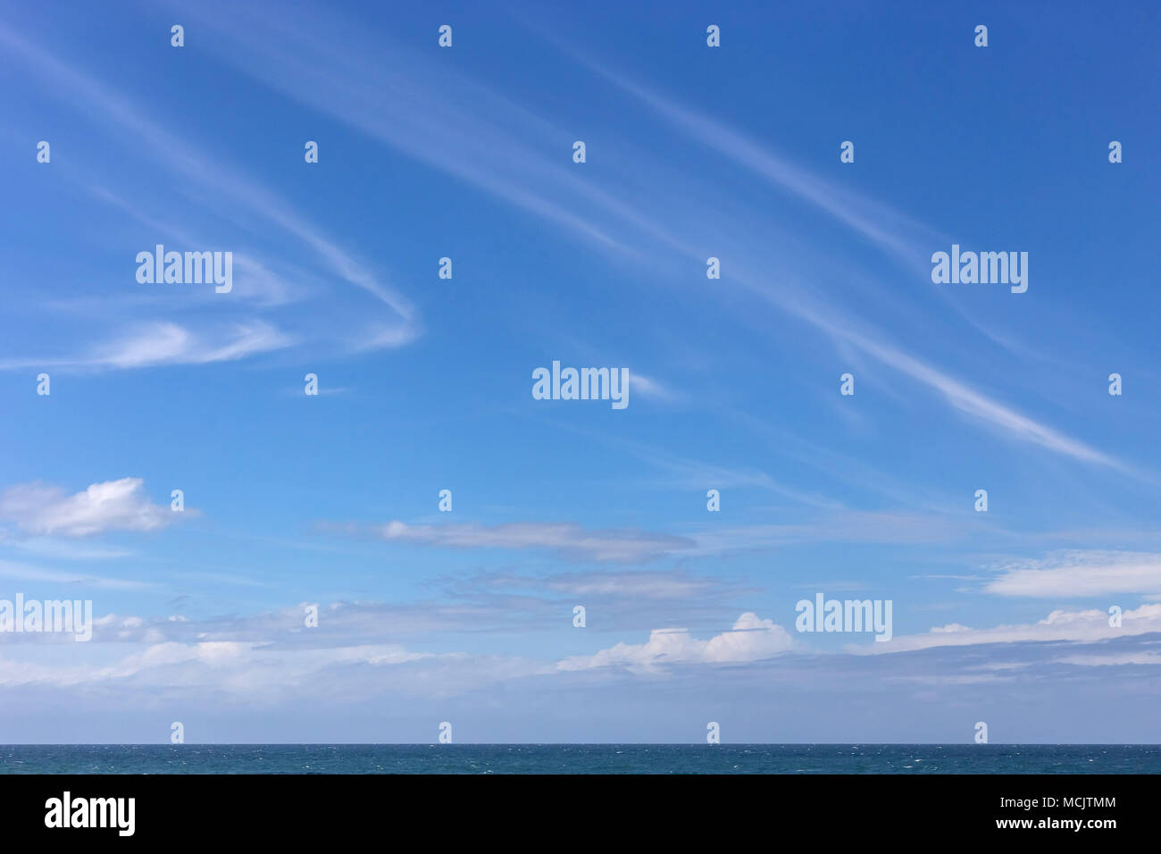Cirrus clouds in the sky, far out to sea in Durban, South Africa. Stock Photo
