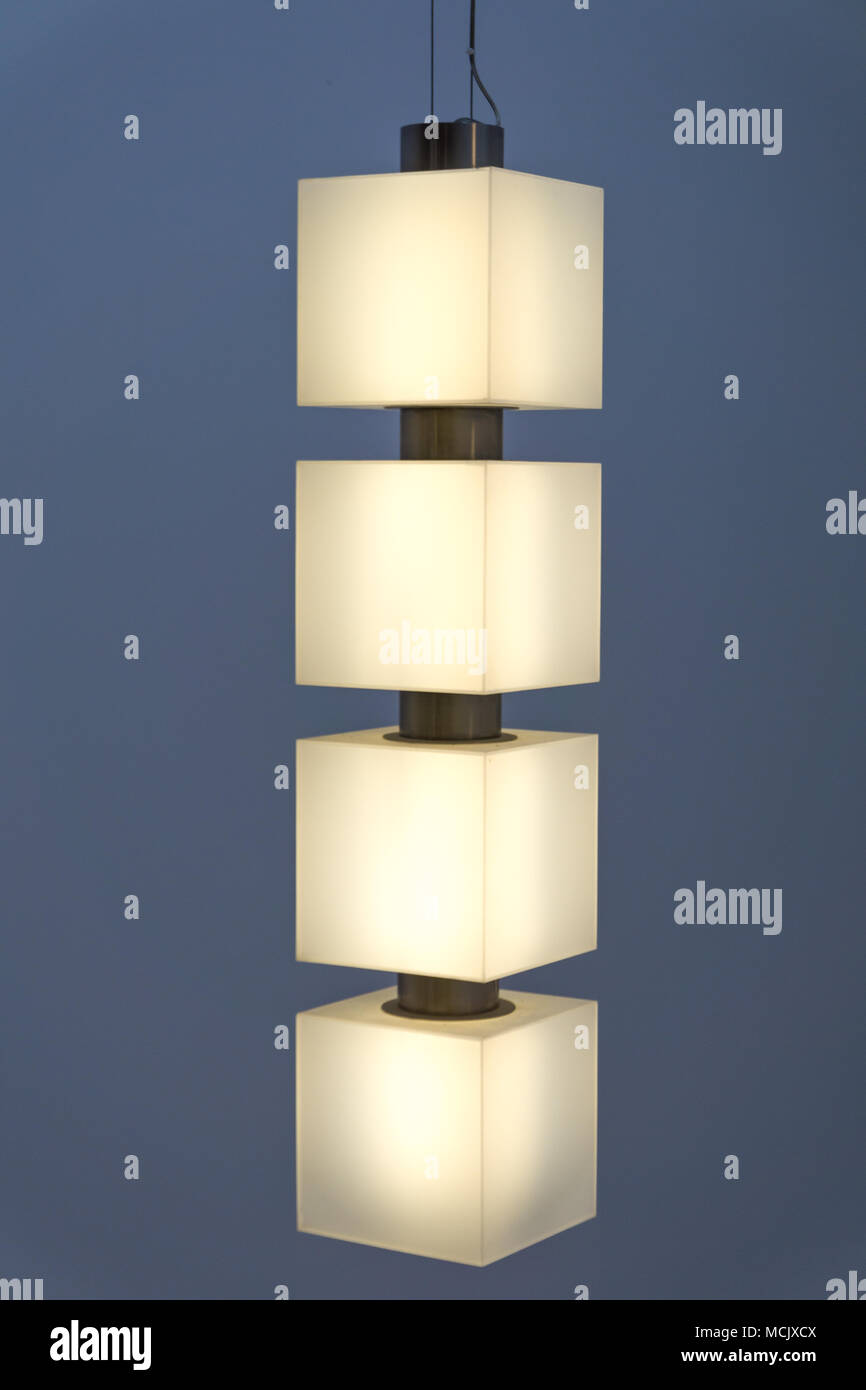 Modern pendant style ceiling lamp glowing. Ceiling lamp installation