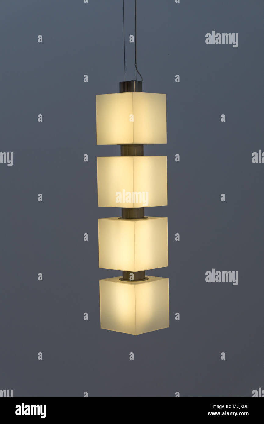 Modern pendant style ceiling lamp glowing. Ceiling lamp installation