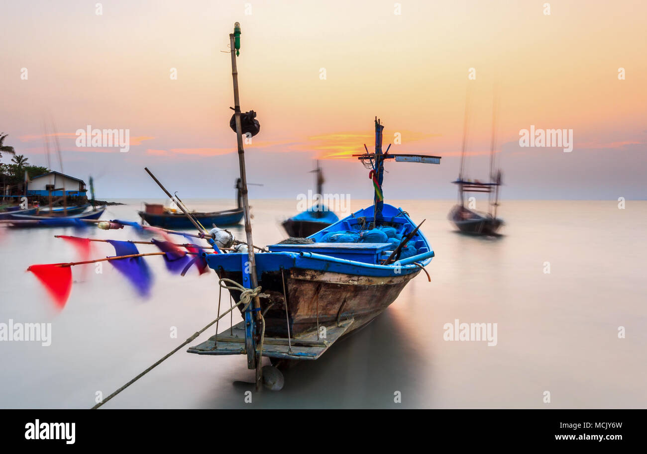 fishing boat at sea with sunset Stock Photo - Alamy