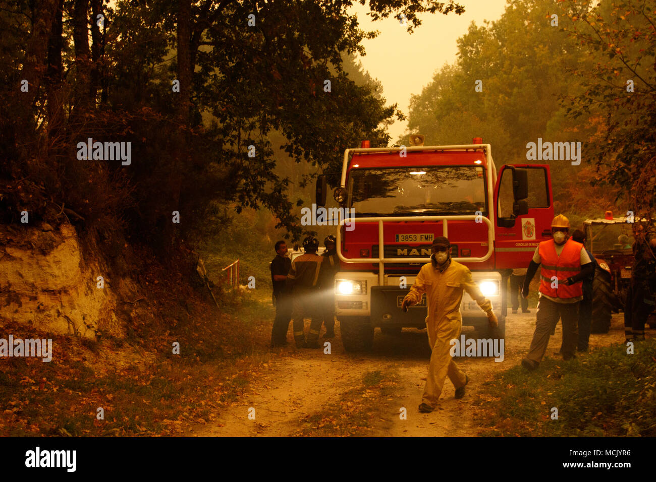 Maceda, Galicia / Spain - Oct 16 2017: Volunteers in forest fire. Stock Photo