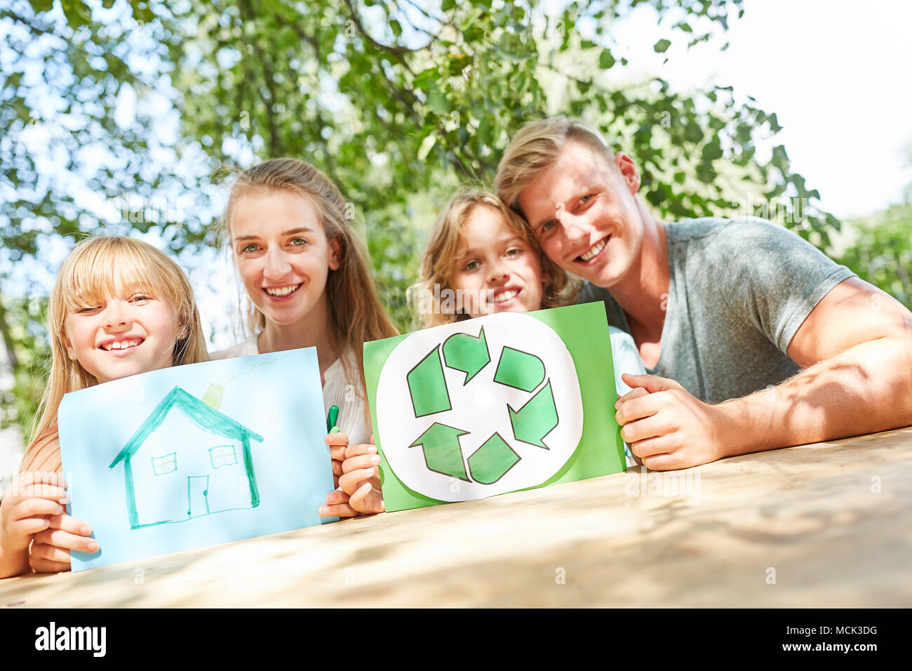 Family and kids keep eco house logo and drawing of home Stock Photo