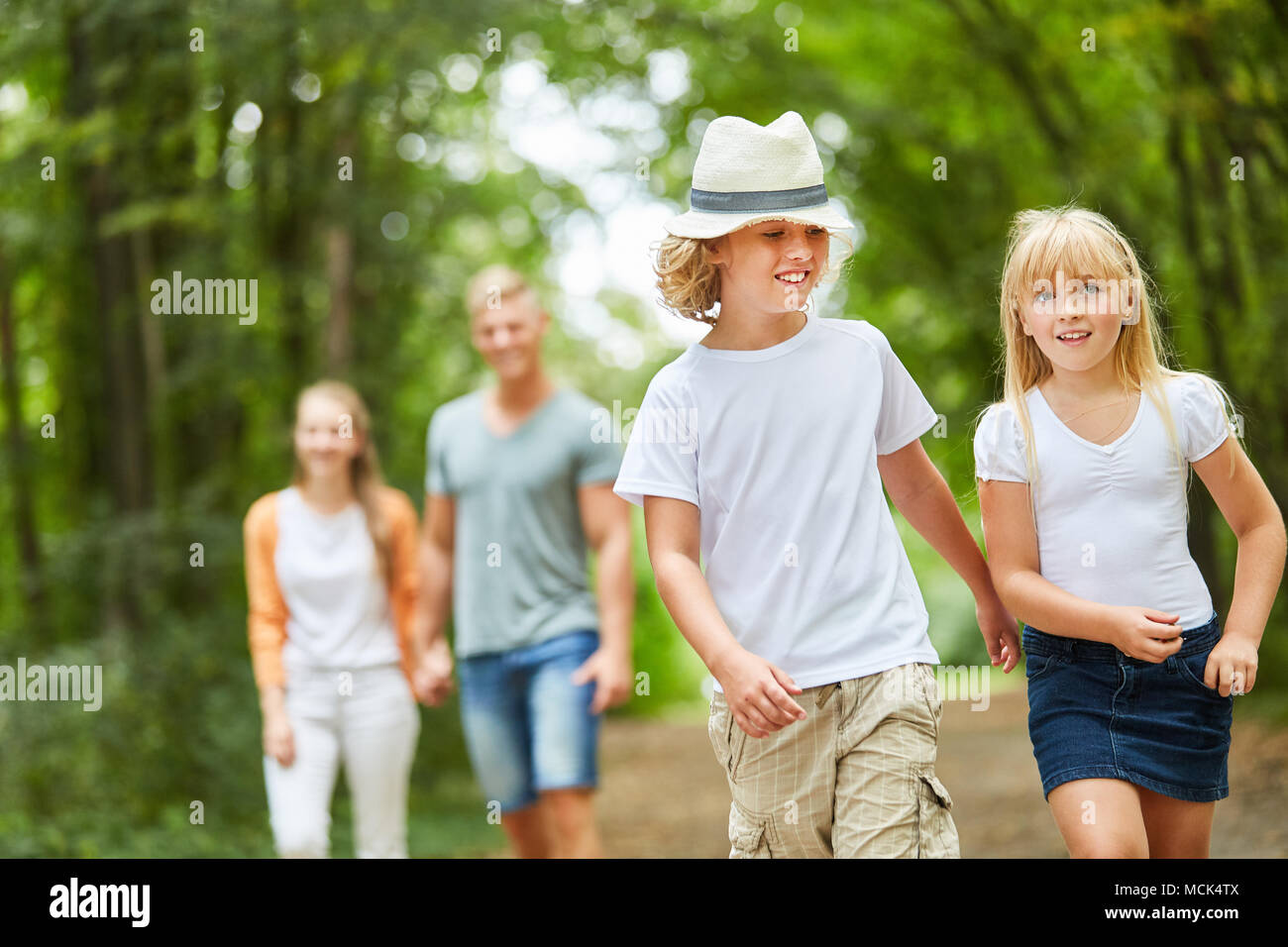 Family and children on a trip or a walk in nature Stock Photo