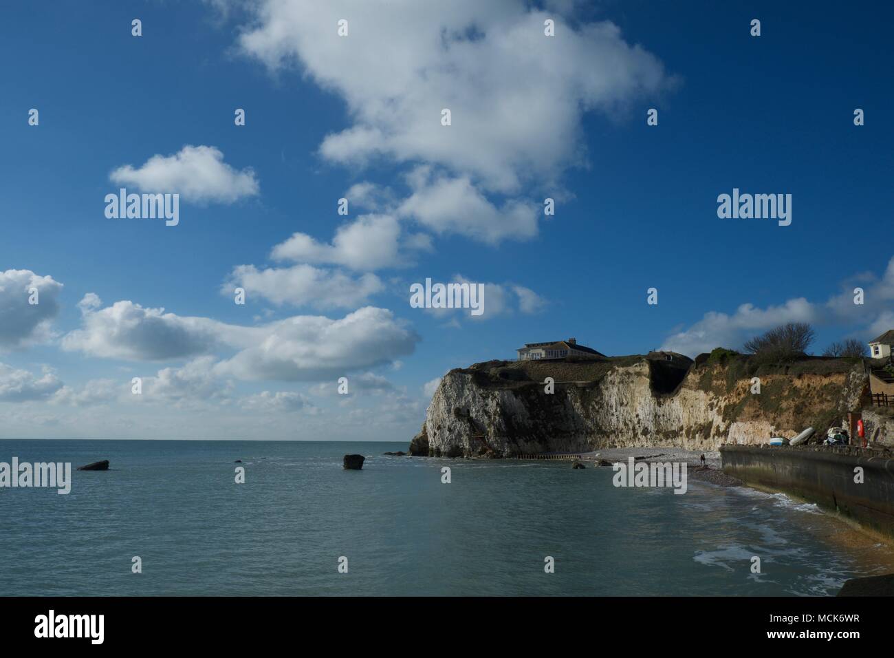 A sunny day with some white clouds at Freshwater Bay on the Isle of Wight United Kingdom UK Stock Photo