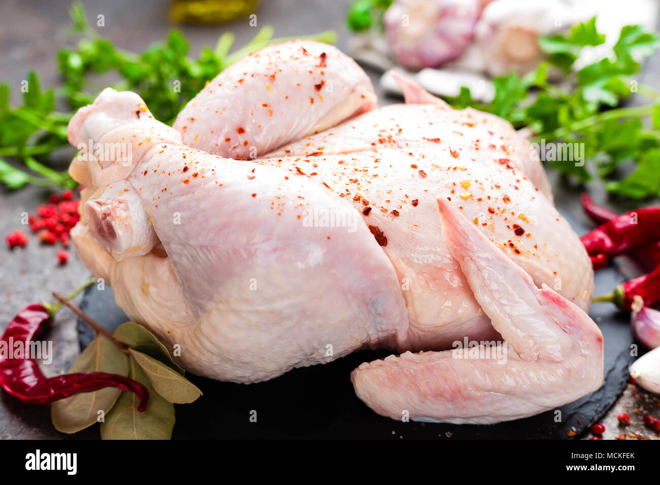Raw chicken. Fresh whole chicken with ingredients for cooking Stock