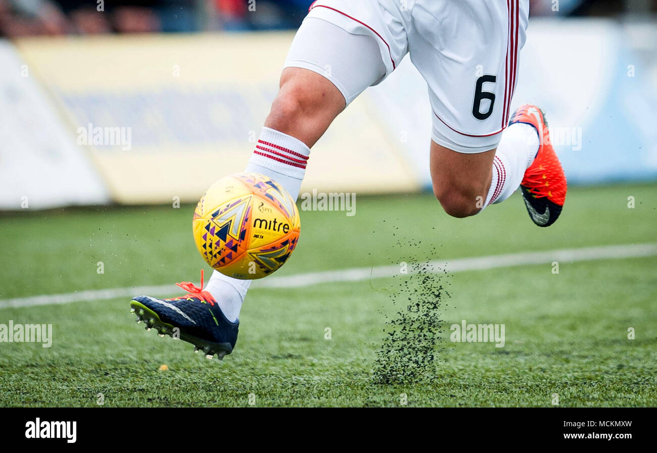 Rubber crumb pellets bounce up on an artificial football pitch Stock Photo