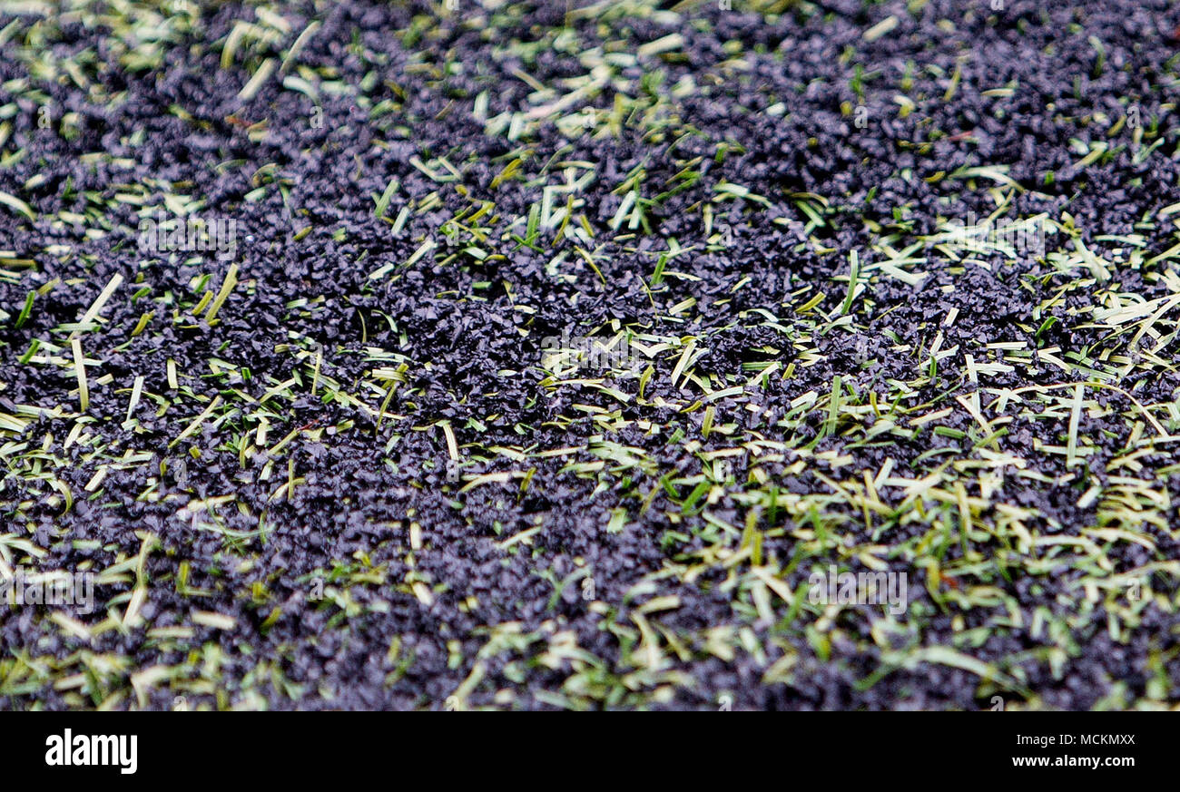 Rubber crumb pellets on an artificial football pitch Stock Photo