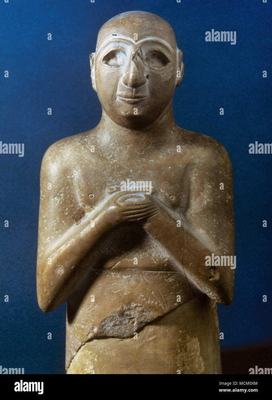 Statue bearing an inscription on the back: Satam, son of Lu-Barab, son of Lugal-Kisal-si, king of Uruk, servant of Girim-si, prince of Uruk. Limestone, Early Dynastic III, ca. 2400 BC. Louvre Museum. Paris, France. Stock Photo