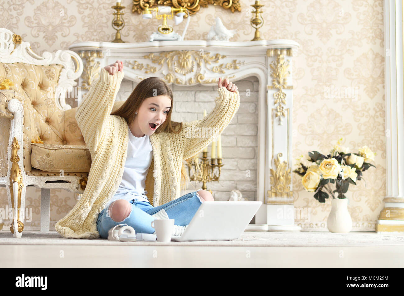 Teen girl sitting on floor hi-res stock photography and images - Alamy