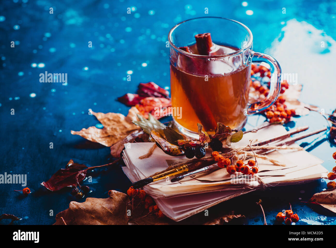 Fall Tea Cups Stack Autumn tea with fallen leaves and a stack of artist scetches with ...