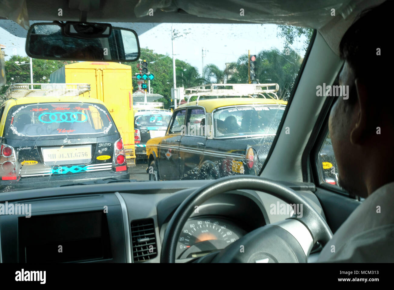 Taxi cab ride with taxis in the street in central Mumbai Stock Photo