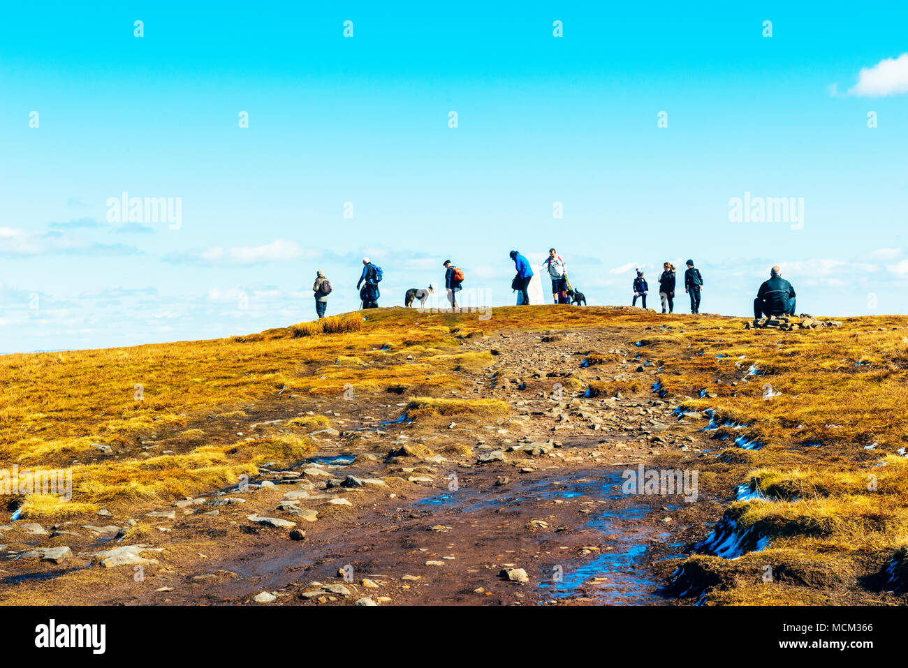 Walkers at the summit of Pendle Hill, Lancashire, England Stock Photo