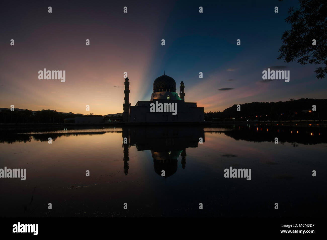 Sunrise with ray of lights by the 'Floating Mosque' in Likas, Kota Kinabalu, Sabah. Stock Photo