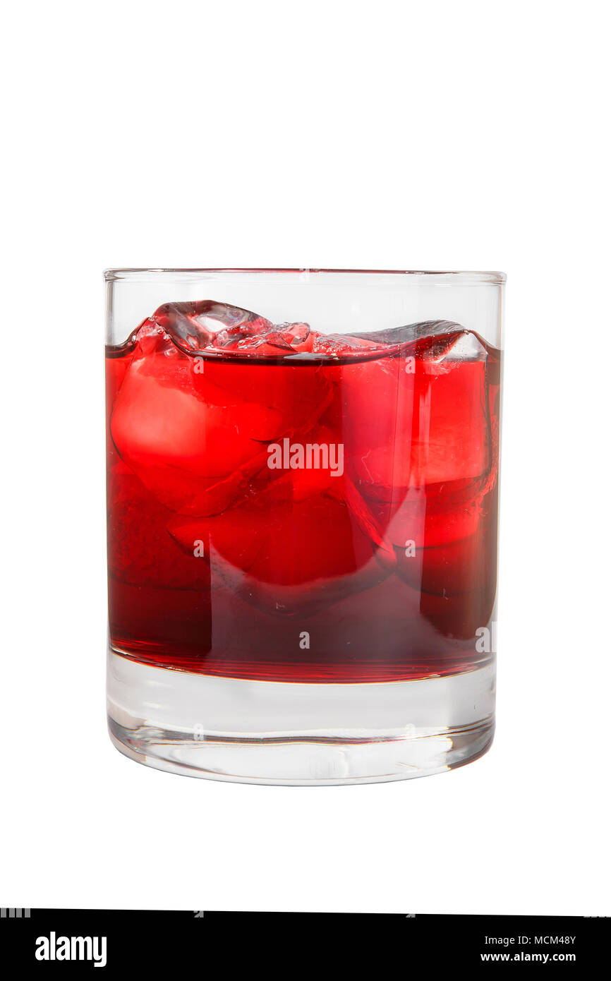 Monochrome transparent cocktail, refreshing in a low glass with a lot of ice cubes with taste of berries, cherries, strawberries, grapefruit. Side vie Stock Photo