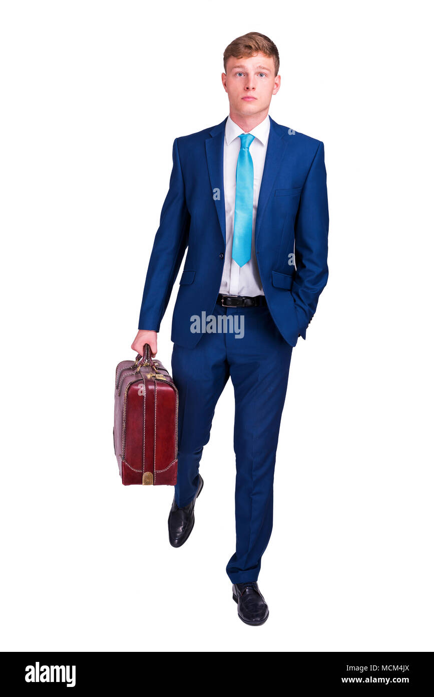 Businessman in suit and tie holding in one hand a suitcase