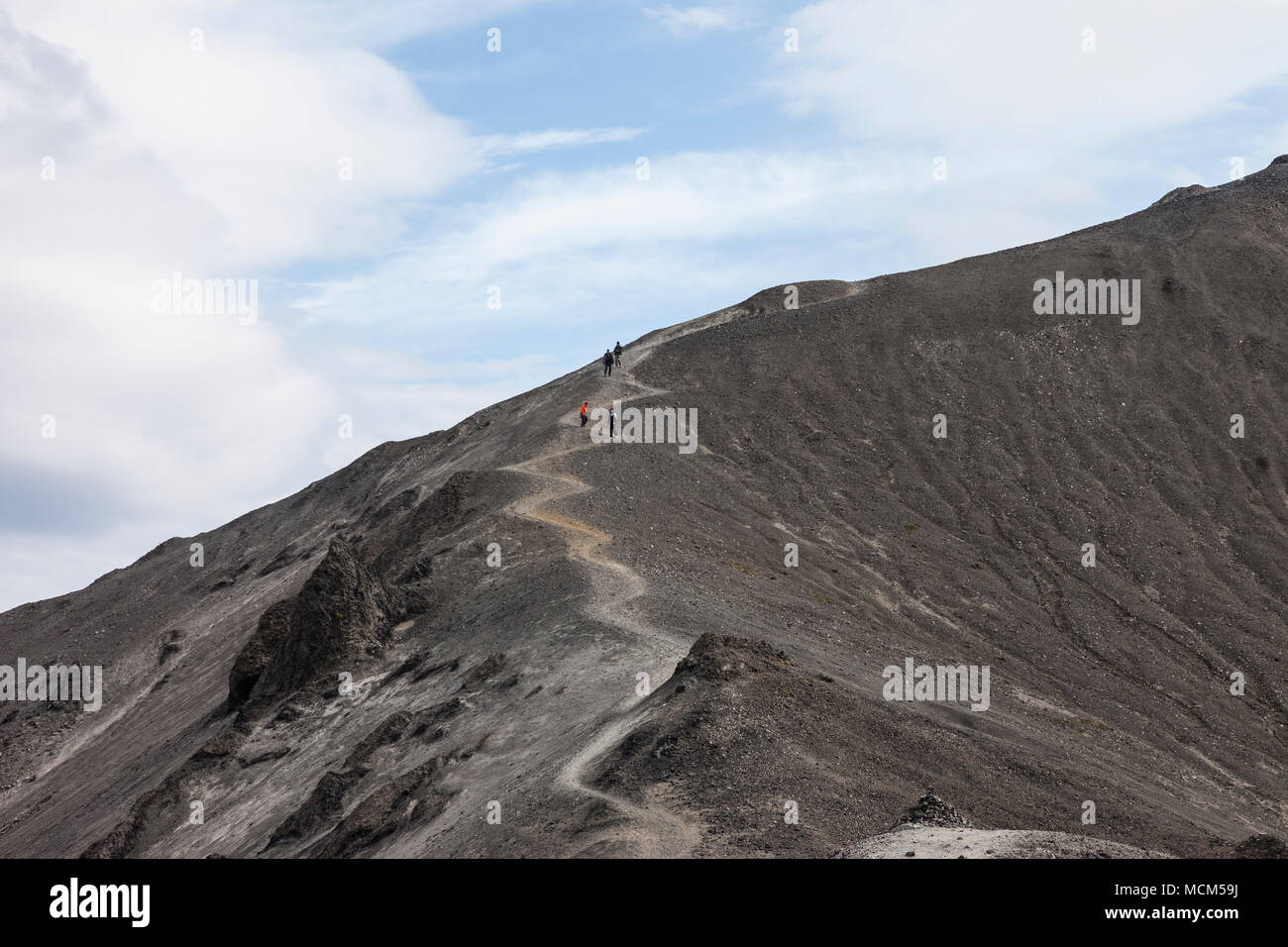 Hikers Decending the Mountain of Blahnukur Landmannalaugar Iceland Stock Photo