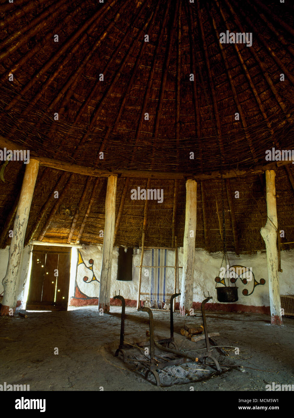 Interior view of Moel y Gaer Iron Age house at Butser Ancient Farm, Hampshire, UK, looking SE. An archaeological reconstruction based on excavation. Stock Photo