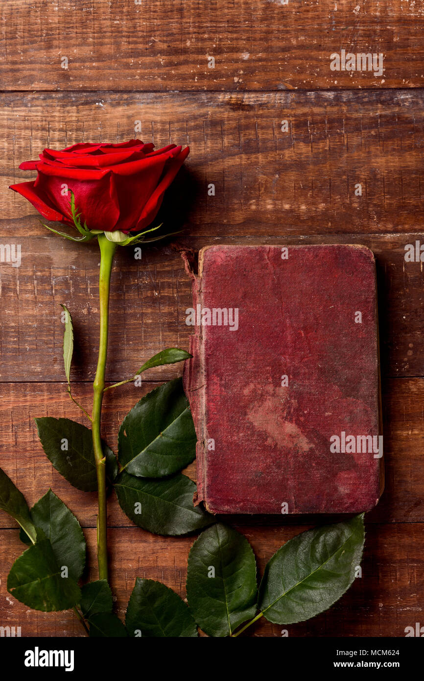 High Angle View Of A Red Rose And A Book For Sant Jordi The