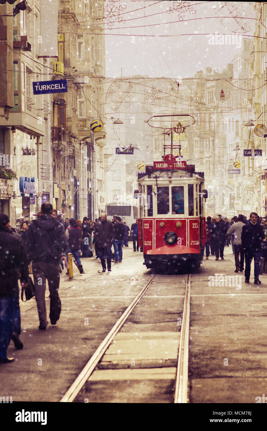 Taksim square in Istanbul and red tram in winter. Stock Photo