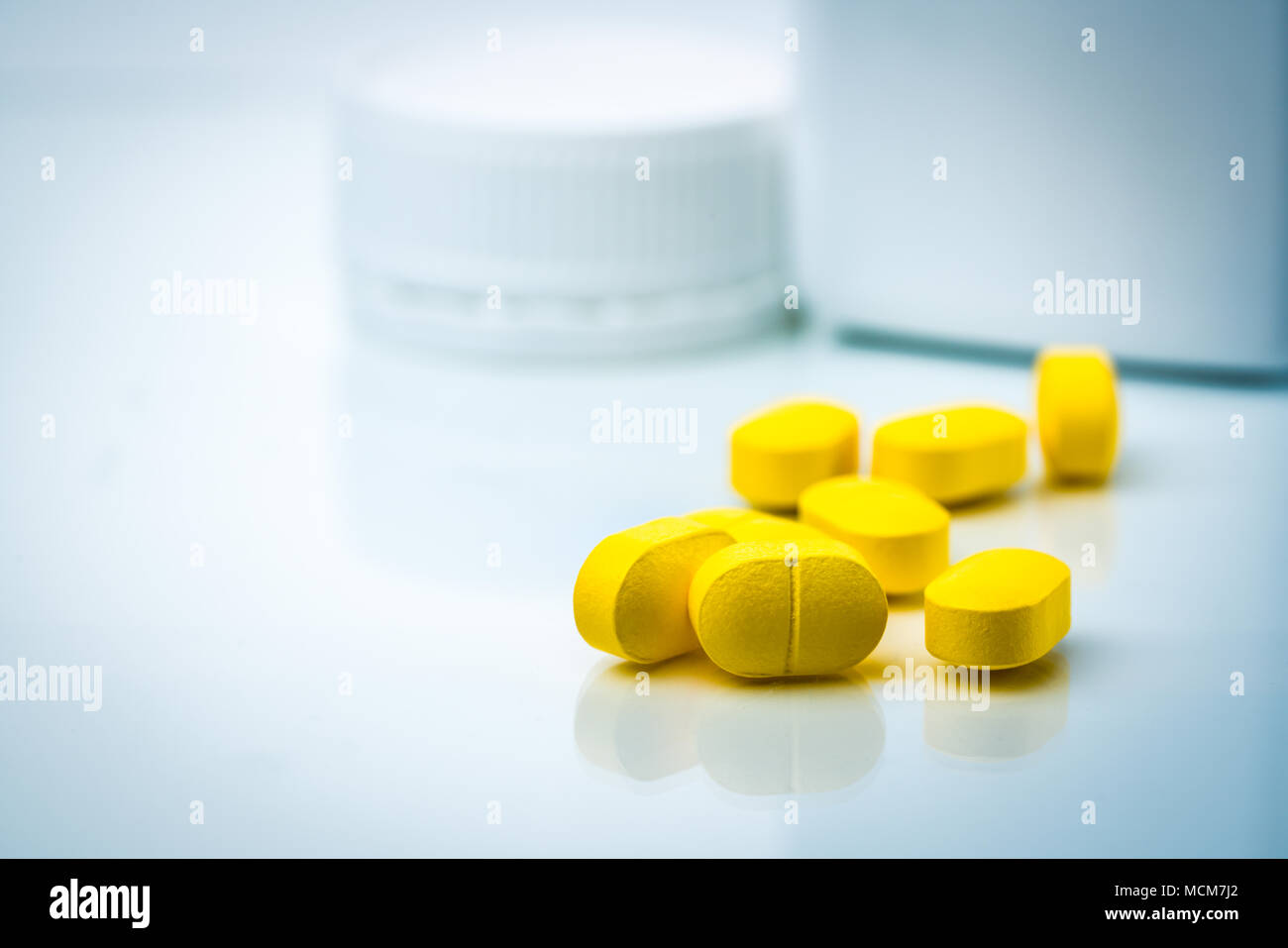 Download Pile Of Yellow Tablets Pills On Blurred Background Of Plastic Pills Bottle With Copy Space Ibuprofen For Relief Pain Headache High Fever And Anti I Stock Photo Alamy Yellowimages Mockups