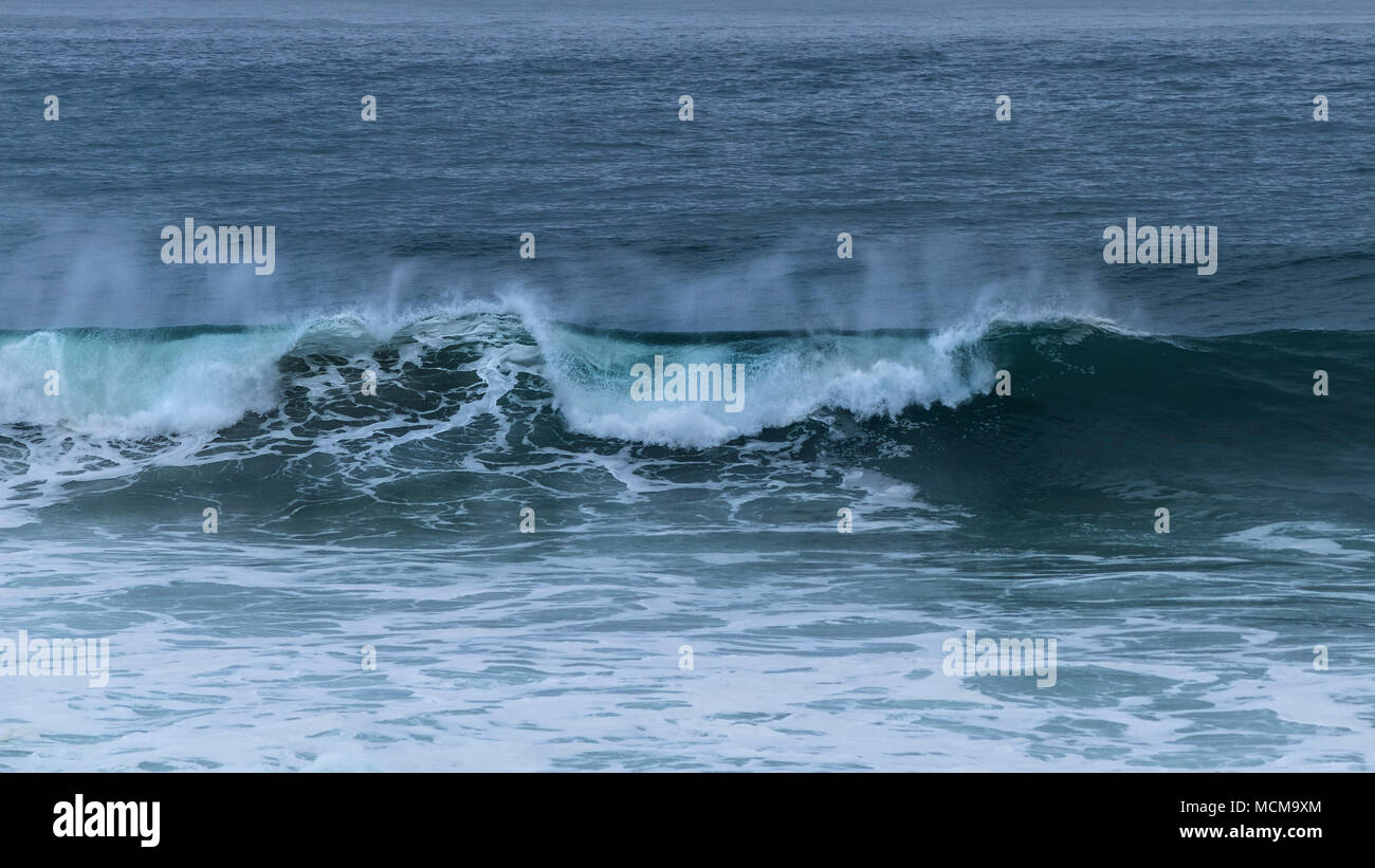 A panoramic view of large wave breaking at Fistral in Newquay Cornwall. Stock Photo
