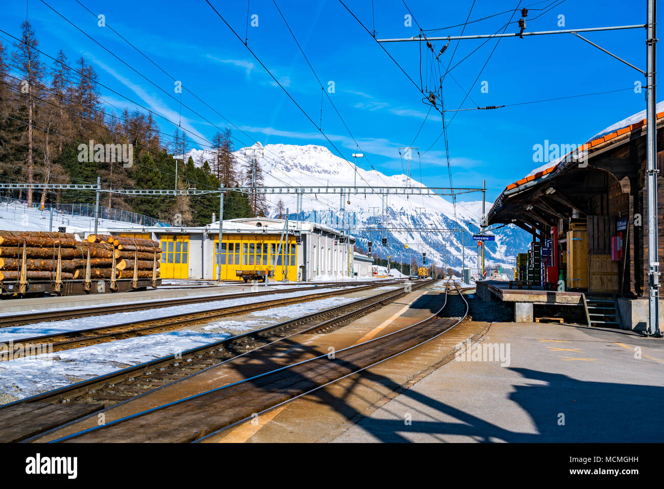 Switzerland landscape of snow mountain at the railway station in the morning Stock Photo
