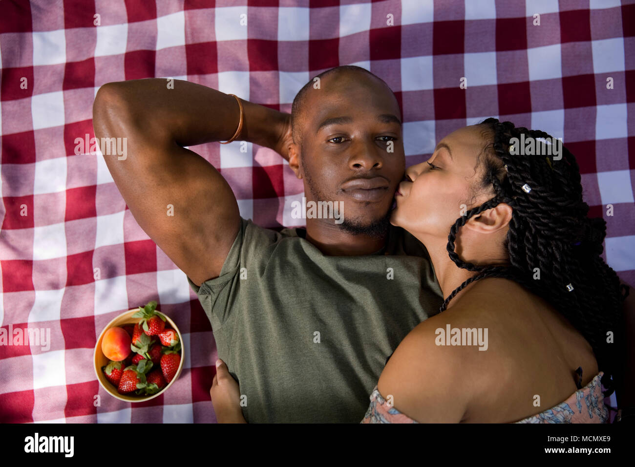 Couple kissing park lying hi-res stock photography and images - Alamy