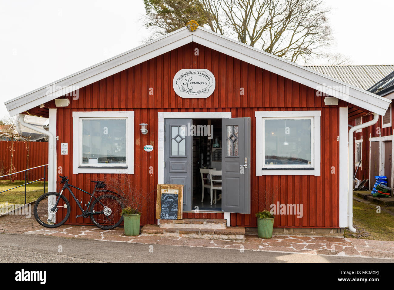 Stora ror, Sweden - April 7, 2018: Documentary of everyday life and environment. The harbor cafe and bakery Mormors (Grandmothers) with open door. Peo Stock Photo