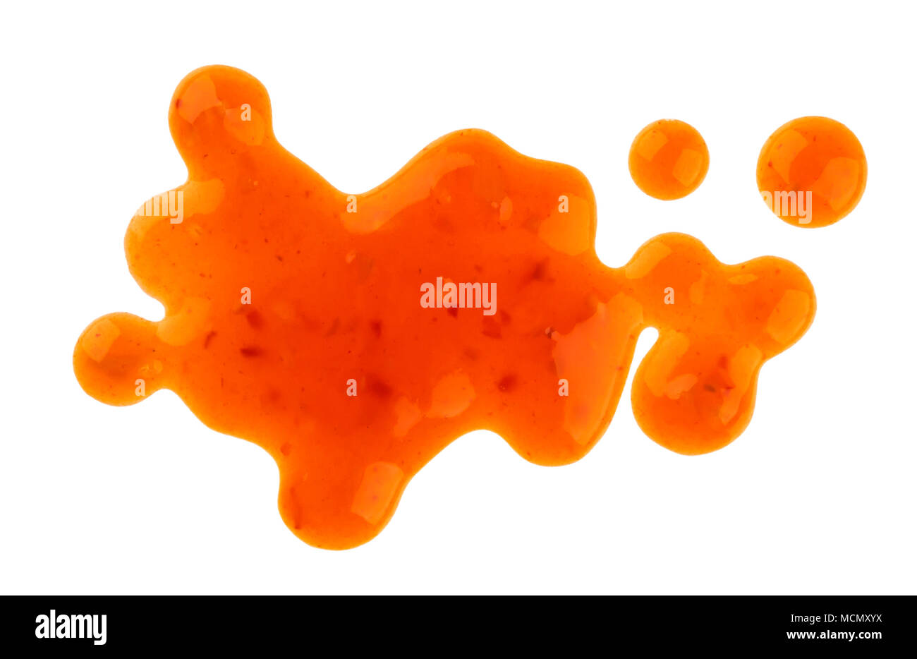Sweet and sour sauce stains. Splashes and spilled orange sauce isolated on white background. Top