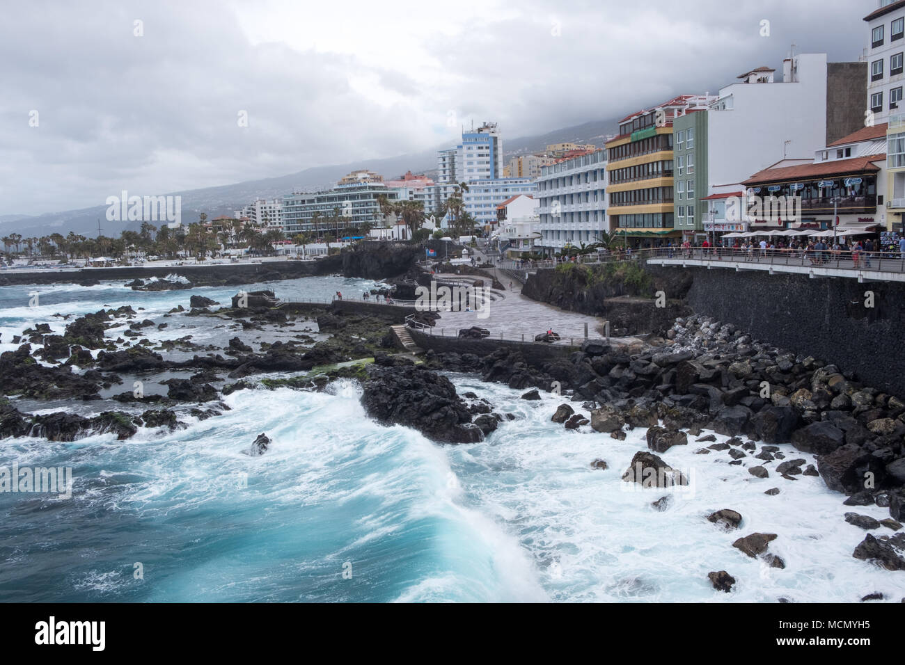 Puerto de la Cruz, Tenerife, Canary Islands;  rough seas on the well-maintained seafront as the wind picks up from an approaching storm. Stock Photo