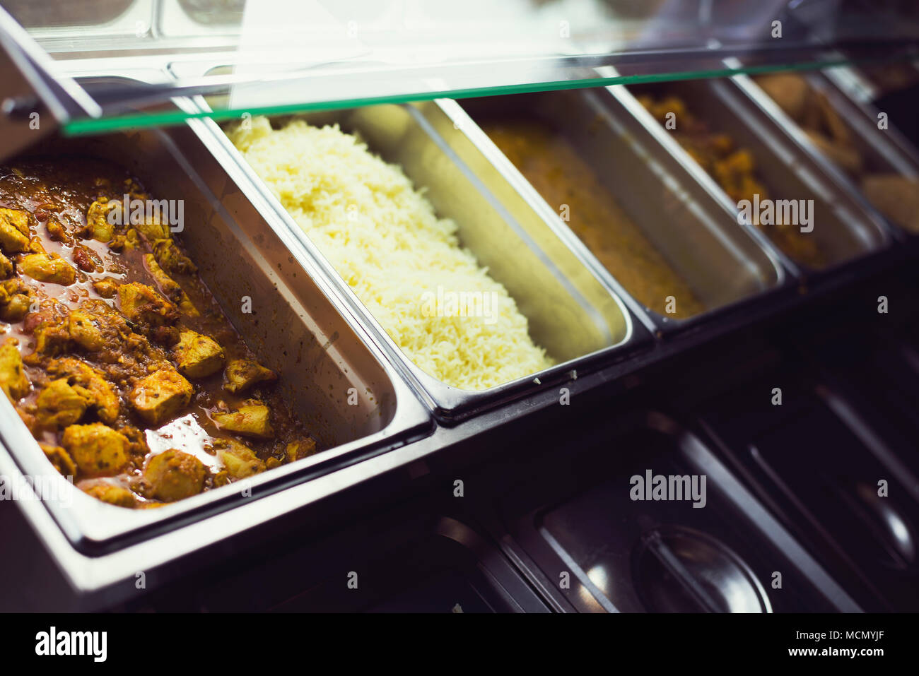 curry and rice in heat trays Stock Photo Alamy