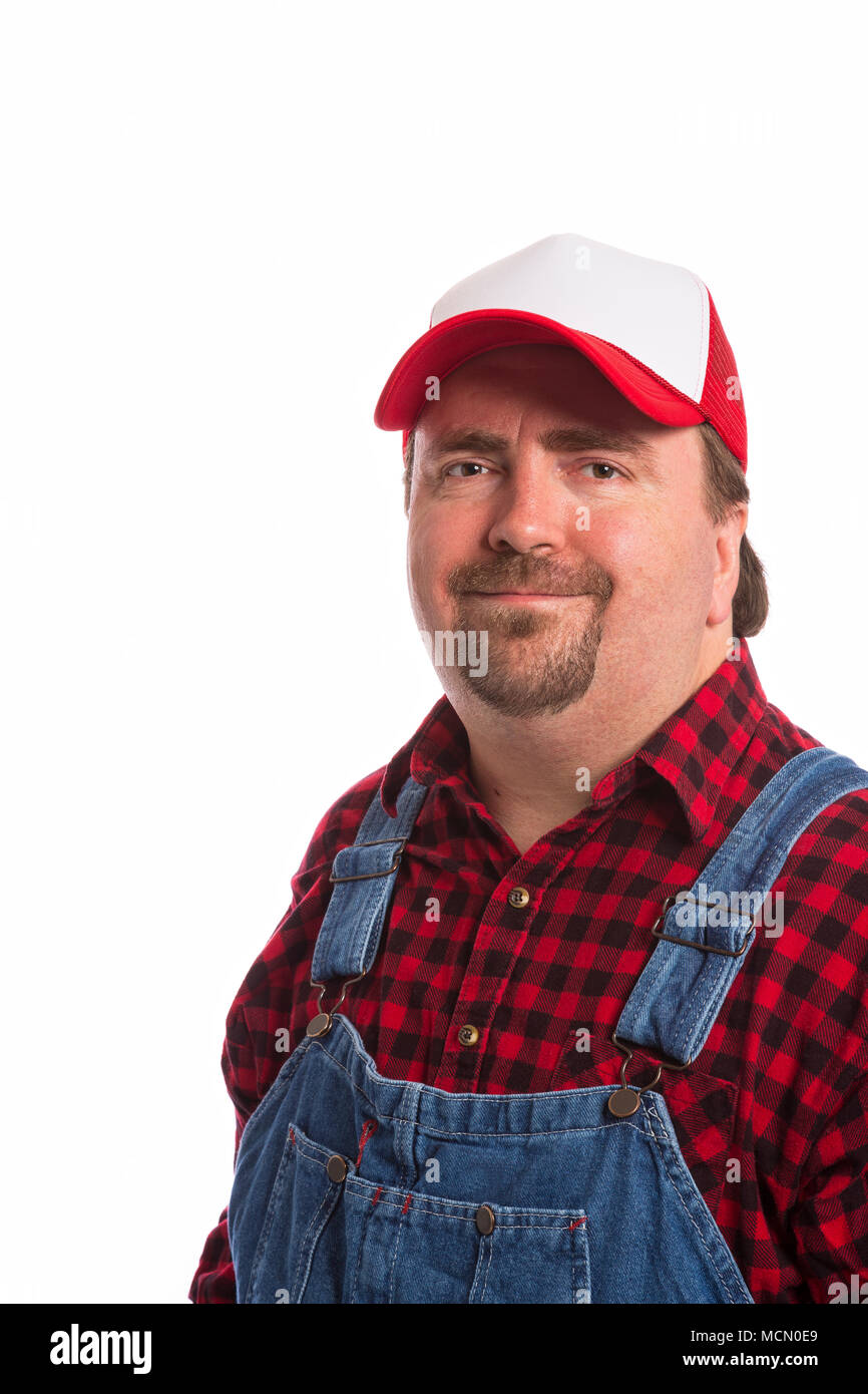 Male Workman in bib overalls, flannel shirt, and hat Stock Photo - Alamy