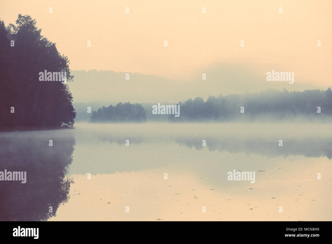 Mirrored misty lake,sunrise,Silkäranta,Espoo,Finland,Europe Stock Photo