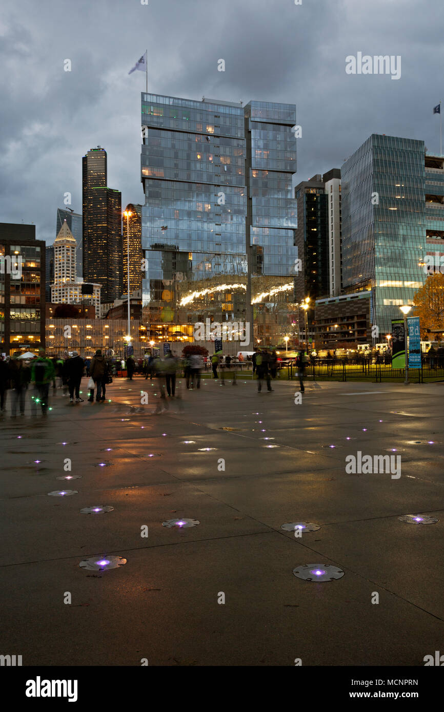 WA15269-00...WASHINGTON - Lights in the pavement outside of CenturyLink stadium with a view of Smith Tower and the Columbia Tower and surrounding high Stock Photo
