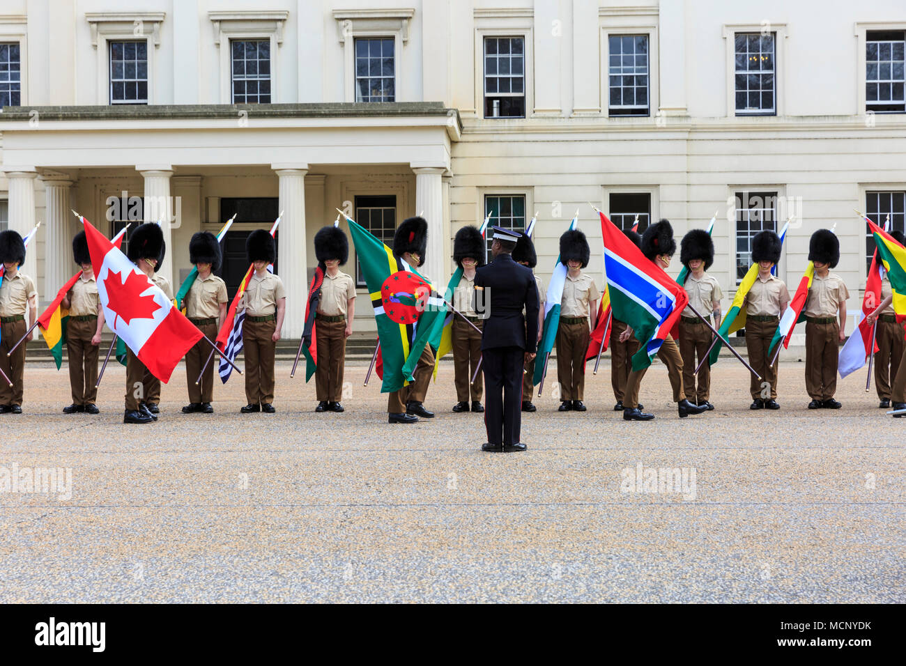 Wellington Barracks, Westminster, London, 17th April 2018. Soldiers from the Foot Guards battalion, Coldstream Guards, and the Coldstream Guards Band, are marching and rehearsing in front of Wellington Barracks, carrying the flags of the Commonwealth countries. London currently hosts the CHOGM, Commonwealth Heads of Government Meeting from 16-20th April 2018. Credit: Imageplotter News and Sports/Alamy Live News Stock Photo