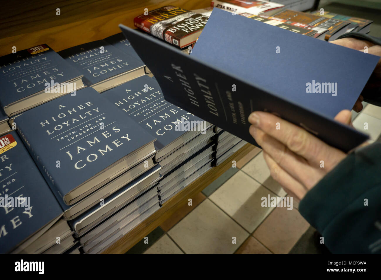 Copies of former FBI Director James Comey's book 'A Higher Loyalty: Truth, Lies, and Leadership' about President Donald Trump in a Barnes & Noble bookstore in New York on the day of its release, Tuesday, April 17, 2018. The publisher Macmillan has printed 850,000 copies of the book in anticipation of the expected demand. The first run of the last Trump book, by Michael Wolff, 'Fire and Fury', also published by Macmillan, was initially only 150,000 copies. (Â© Richard B. Levine) Stock Photo
