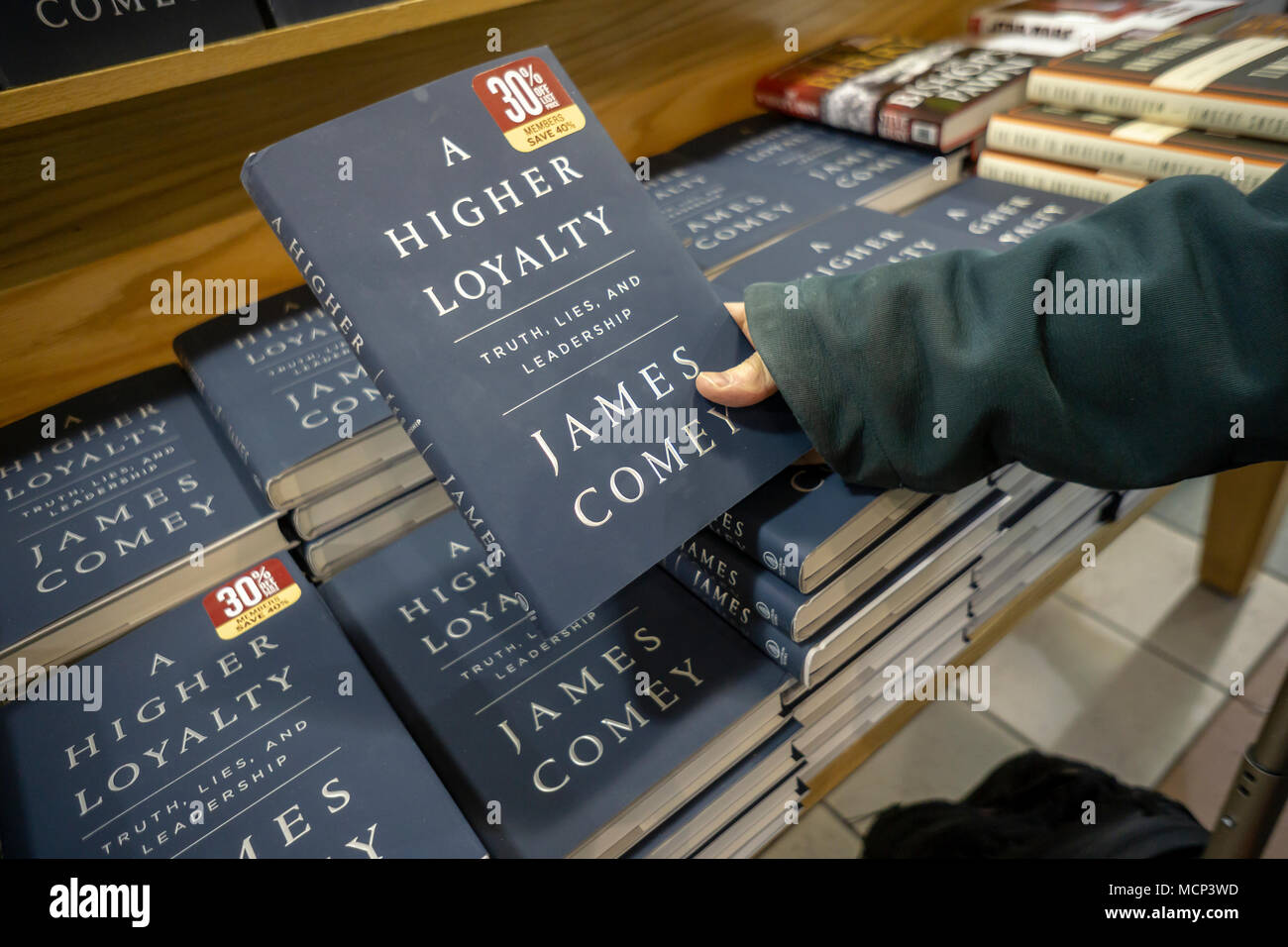 Copies of former FBI Director James Comey's book 'A Higher Loyalty: Truth, Lies, and Leadership' about President Donald Trump in a Barnes & Noble bookstore in New York on the day of its release, Tuesday, April 17, 2018. The publisher Macmillan has printed 850,000 copies of the book in anticipation of the expected demand. The first run of the last Trump book, by Michael Wolff, 'Fire and Fury', also published by Macmillan, was initially only 150,000 copies. (© Richard B. Levine) Stock Photo
