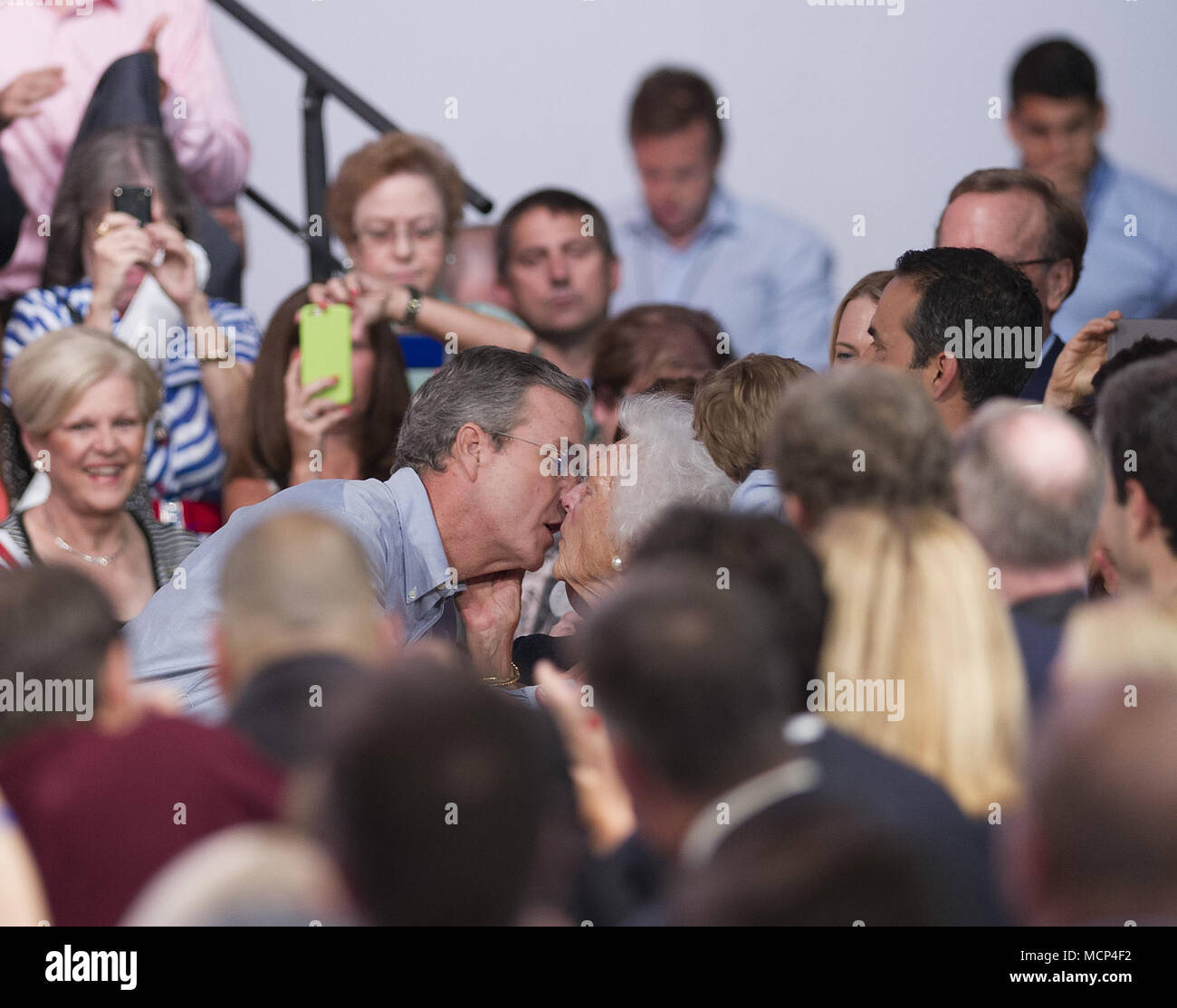 MIAMI, FL - JUNE 15: Jeb Bush looks like hes about to lock lips with mom Barbara Bush. Former Florida Governor Jeb Bush on stage to announce his candidacy for the 2016 Republican presidential nomination at Miami Dade College - Kendall Campus Theodore Gibson Health Center (Gymnasium) June 15, 2015 in Miami, Florida. John Ellis 'Jeb' Bush will attempt to follow his brother and father into the nation's highest office when he officially announces today that he'll run for president of the United States. People: Jeb Bush, Barbara Bush Credit: hoo-me.com/MediaPunch/MediaPunch Stock Photo