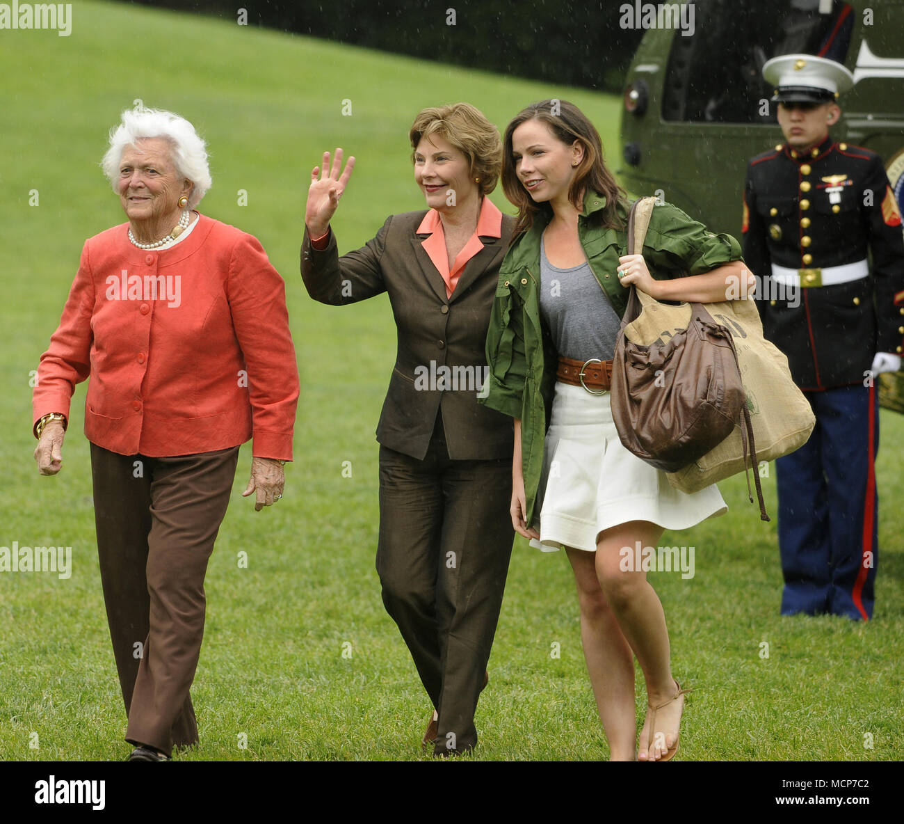 Washington, District of Columbia, USA. 11th May, 2008. First lady Laura Bush waves to onlookers as she walks with former first lady Barbara Bush (L) and daughter Barbara as they arrive at the White from a weekend at the Crawford, Texas ranch, 11 May 2008 in Washington, DC. United States President George W. Bush, whose daughter Jenna married Henry Hager at the ranch, described the experience as 'spectacular' and 'it's all we could have hoped for'. Credit: Mike Theiler/Pool via CNP Credit: Mike Theiler/CNP/ZUMA Wire/Alamy Live News Stock Photo